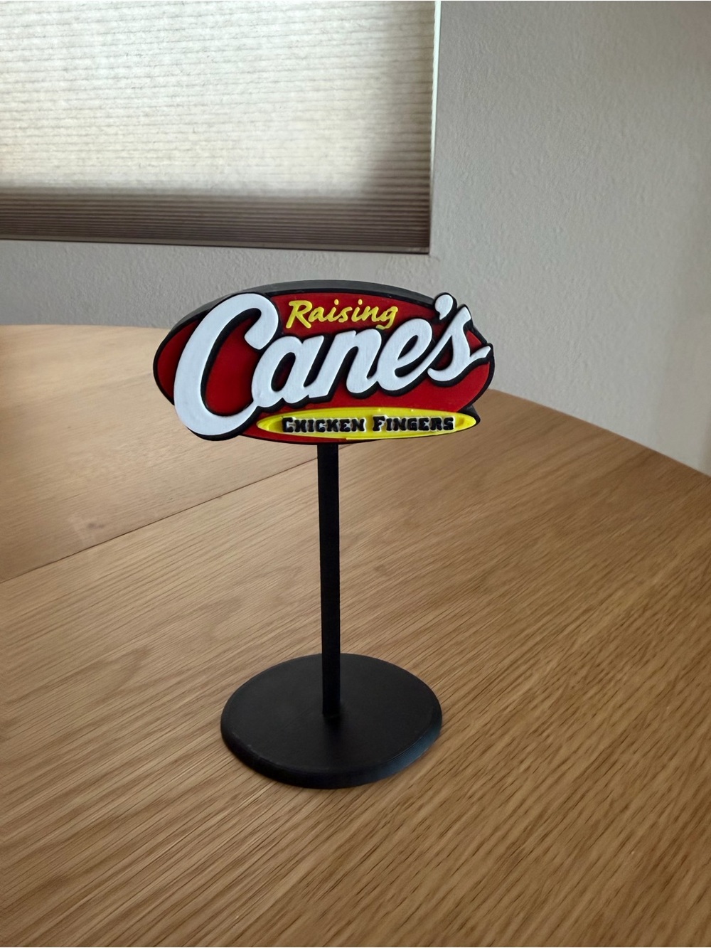 Raising Cane’s Chicken Fingers logo display stand